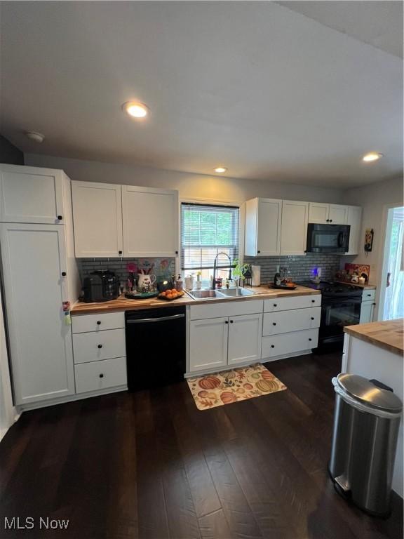 4389 Devonshire Dr, Boardman, OH 44512 - kitchen featuring black appliances, butcher block counters, white cabinetry, and recessed lighting