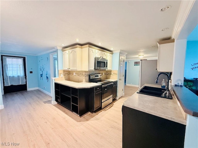 133 Walleye Ct, Lagrange, OH 44050 - kitchen with stainless steel appliances, open shelves, decorative backsplash, light wood-style flooring, and crown molding