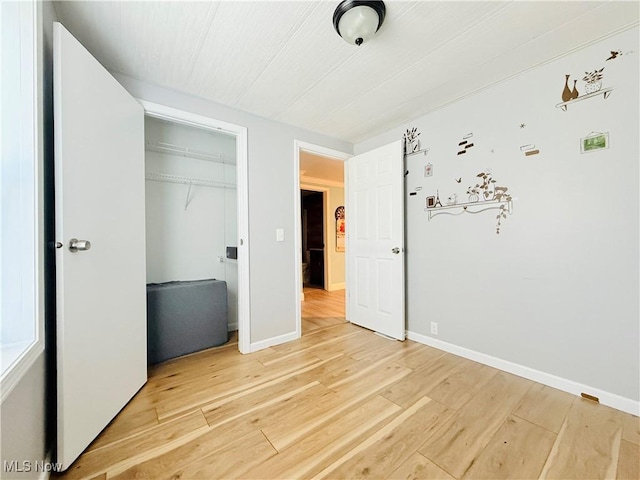 133 Walleye Ct, Lagrange, OH 44050 - unfurnished bedroom with light wood finished floors and a closet