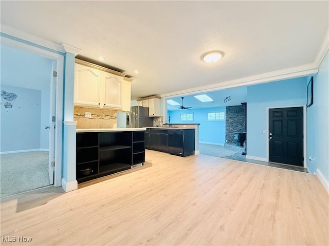 133 Walleye Ct, Lagrange, OH 44050 - kitchen with a peninsula, open floor plan, light wood-style floors, a stone fireplace, and open shelves