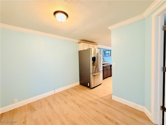 133 Walleye Ct, Lagrange, OH 44050 - kitchen featuring stainless steel fridge, ornamental molding, light wood-style flooring, and a textured ceiling