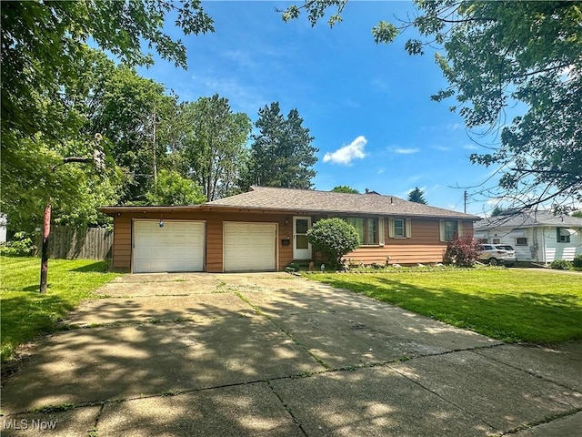 1422 Youll St, Niles, OH 44446 - ranch-style home featuring an attached garage and concrete driveway
