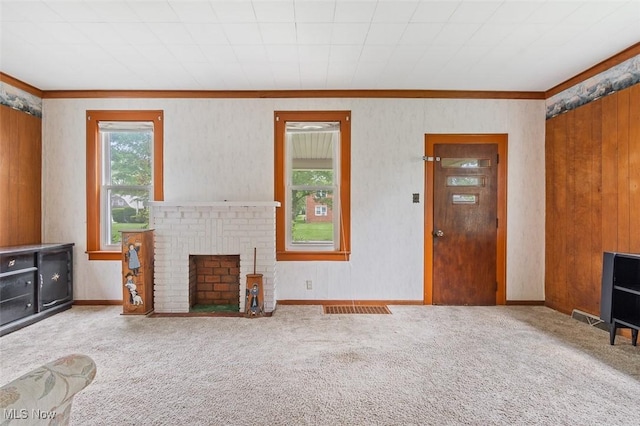 436 N Portage St, Doylestown, OH 44230 - unfurnished living room featuring crown molding, carpet flooring, and a fireplace
