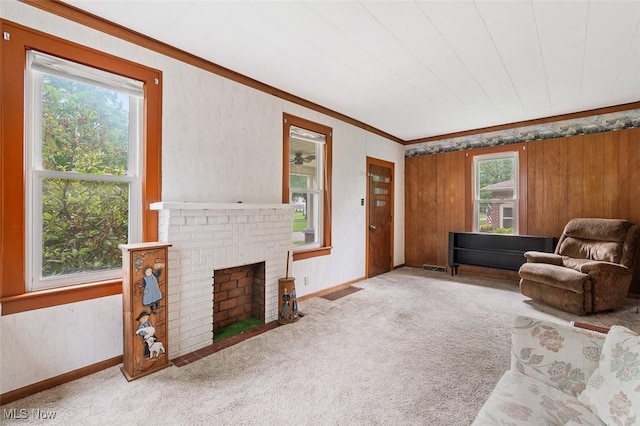 436 N Portage St, Doylestown, OH 44230 - living room with crown molding, carpet flooring, and a brick fireplace