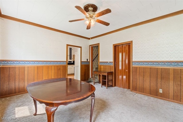 436 N Portage St, Doylestown, OH 44230 - office area featuring a ceiling fan, a wainscoted wall, wood walls, carpet flooring, and crown molding
