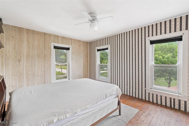 436 N Portage St, Doylestown, OH 44230 - bedroom with hardwood / wood-style floors, ceiling fan, and wallpapered walls