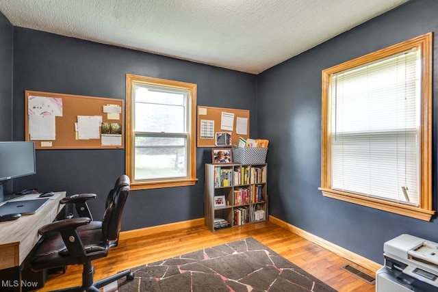 11339 Ridge Rd, North Royalton, OH 44133 - home office featuring wood finished floors and a textured ceiling