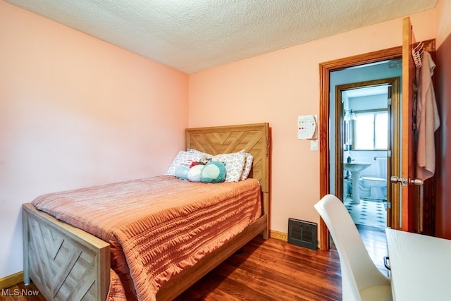 11339 Ridge Rd, North Royalton, OH 44133 - bedroom featuring wood finished floors and a textured ceiling