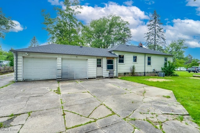 11339 Ridge Rd, North Royalton, OH 44133 - back of house featuring a yard, driveway, and a garage