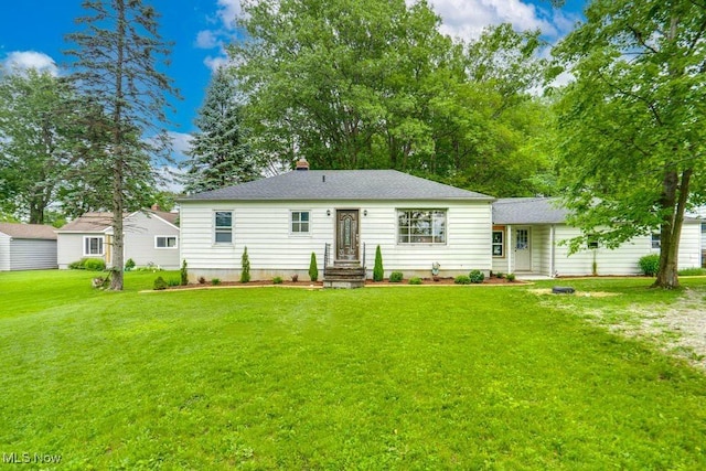 11339 Ridge Rd, North Royalton, OH 44133 - back of property featuring a yard, a chimney, and a shingled roof