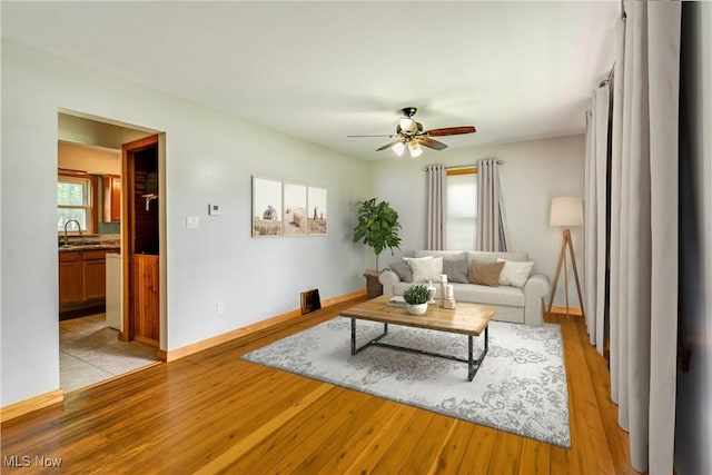 11339 Ridge Rd, North Royalton, OH 44133 - living room featuring ceiling fan and light wood finished floors