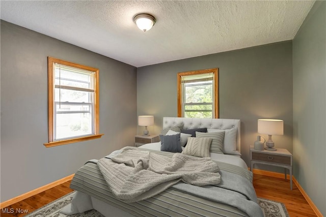 11339 Ridge Rd, North Royalton, OH 44133 - bedroom featuring a textured ceiling and wood finished floors