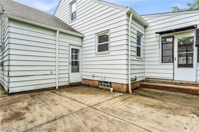 416 E 255th St, Euclid, OH 44132 - view of property exterior with a patio area and roof with shingles