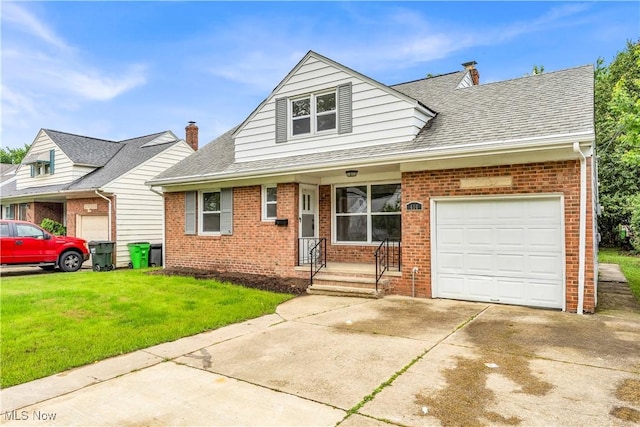 416 E 255th St, Euclid, OH 44132 - view of front facade with brick siding and a front lawn