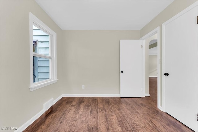 416 E 255th St, Euclid, OH 44132 - unfurnished room with arched walkways and wood finished floors