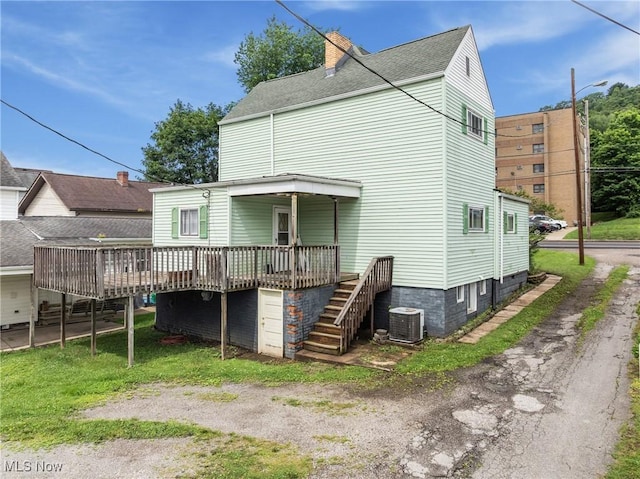3480 Central Ave, Shadyside, OH 43947 - rear view of house with a wooden deck, a chimney, and stairs