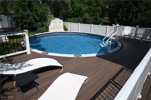 1265 Waterbury Dr, Medina, OH 44256 - view of swimming pool featuring a shed and a wooden deck
