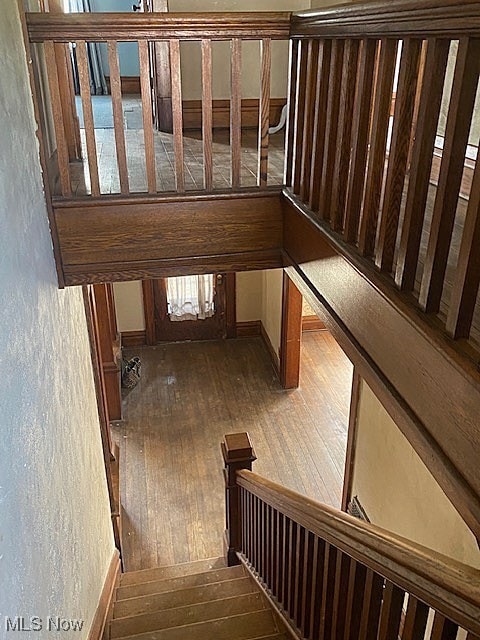104 Jefferson St, Belmont, OH 43718 - stairway with wood-type flooring and a textured wall