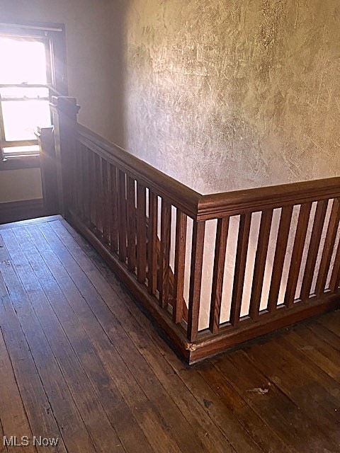 104 Jefferson St, Belmont, OH 43718 - staircase featuring wood-type flooring and wainscoting