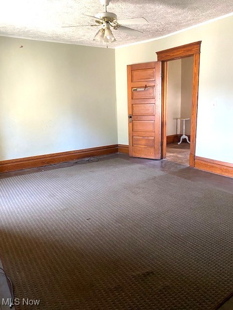 104 Jefferson St, Belmont, OH 43718 - spare room with ceiling fan, a textured ceiling, carpet floors, and crown molding