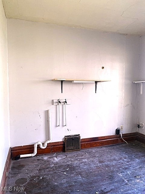 104 Jefferson St, Belmont, OH 43718 - unfurnished living room with baseboards