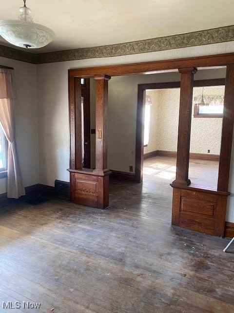 104 Jefferson St, Belmont, OH 43718 - spare room featuring wood finished floors and decorative columns