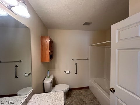 2132 University Commons Dr SE, Massillon, OH 44646 - bathroom featuring vanity, a textured ceiling, and tub / shower combination