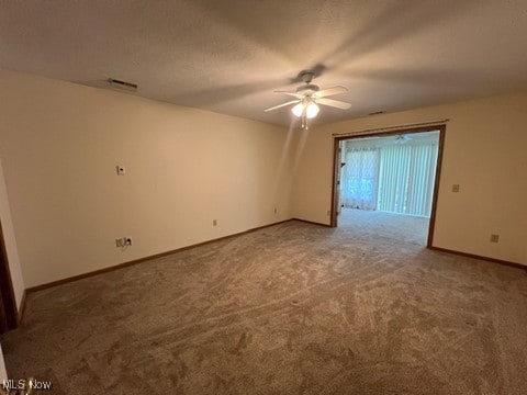 2132 University Commons Dr SE, Massillon, OH 44646 - carpeted empty room featuring a ceiling fan and baseboards