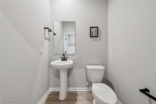 23761 St Andrews Dr, Columbia Station, OH 44028 - half bathroom with toilet and wood finished floors