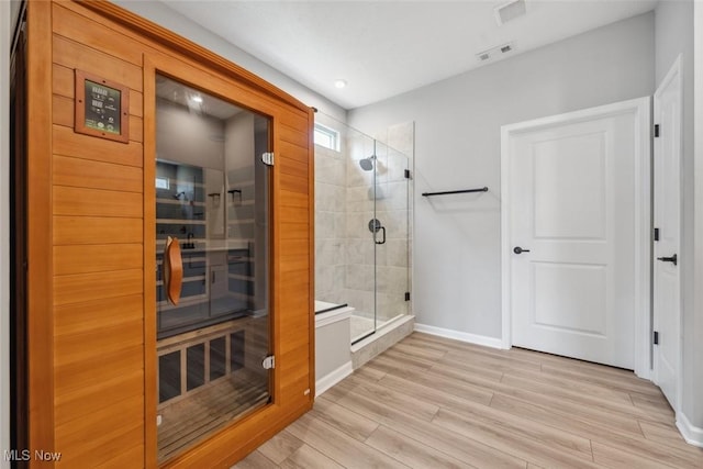 23761 St Andrews Dr, Columbia Station, OH 44028 - full bathroom with a relaxing sauna, a shower stall, wood finished floors, and recessed lighting