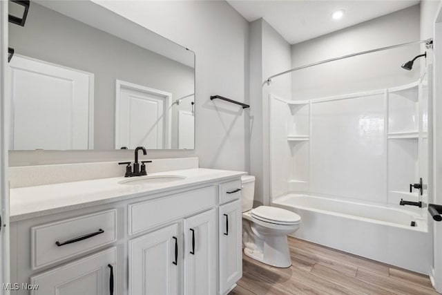 23761 St Andrews Dr, Columbia Station, OH 44028 - bathroom featuring vanity, shower / bath combination, wood finished floors, and recessed lighting