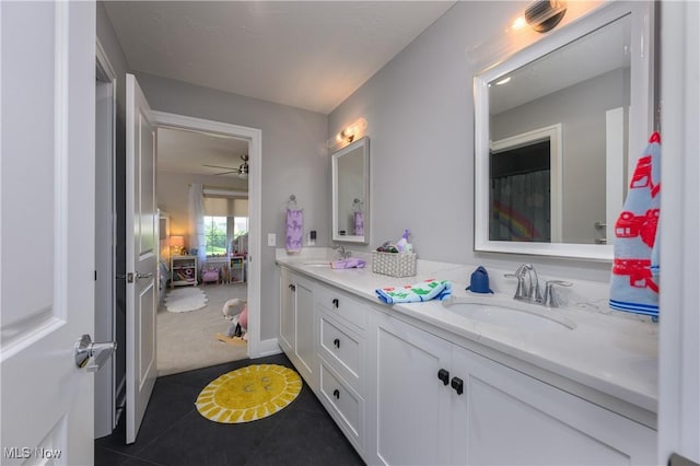 7324 Roman Ave NW, Massillon, OH 44646 - bathroom with double vanity, tile patterned flooring, and ceiling fan