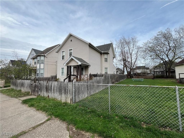 2455 W 7th St, Cleveland, OH 44113 - view of side of property featuring a fenced front yard