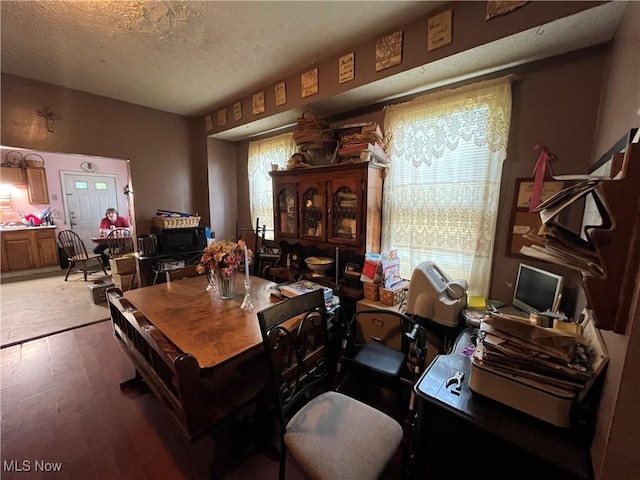 2455 W 7th St, Cleveland, OH 44113 - dining area with wood finished floors and a textured ceiling
