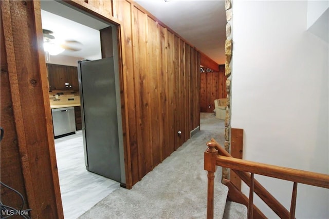 8630 Williams Rd, Chardon, OH 44024 - hallway with wood walls and stairway