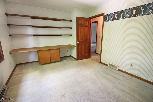 8630 Williams Rd, Chardon, OH 44024 - unfurnished bedroom featuring built in study area and carpet flooring