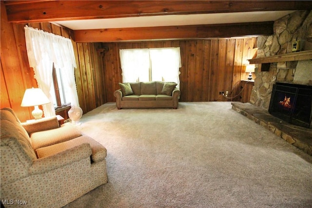 8630 Williams Rd, Chardon, OH 44024 - living room with beamed ceiling, a stone fireplace, carpet, and wood walls