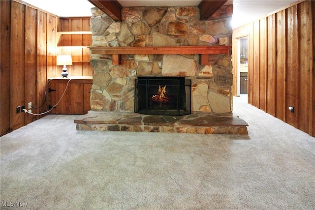 8630 Williams Rd, Chardon, OH 44024 - unfurnished living room with carpet flooring, beamed ceiling, a fireplace, and wooden walls