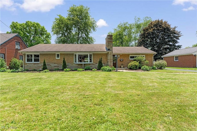 218 Bonnett St SW, North Canton, OH 44720 - single story home with a front lawn and a chimney
