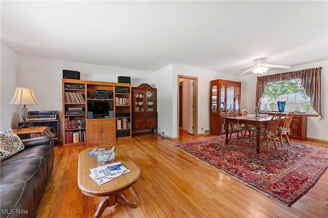 218 Bonnett St SW, North Canton, OH 44720 - living room with light wood-type flooring and a ceiling fan