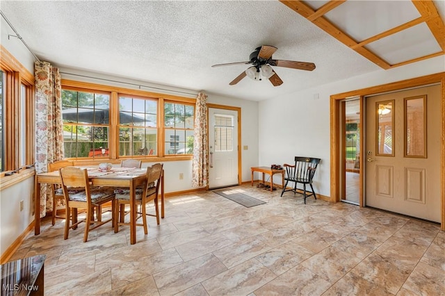 218 Bonnett St SW, North Canton, OH 44720 - dining space with a ceiling fan and a textured ceiling