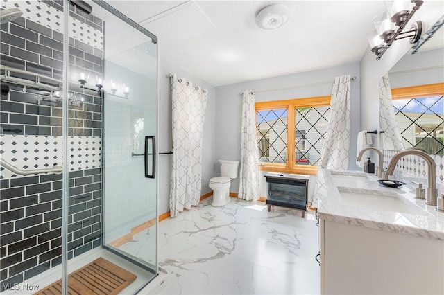 218 Bonnett St SW, North Canton, OH 44720 - full bathroom featuring marble tiled floors, a stall shower, double vanity, and a chandelier