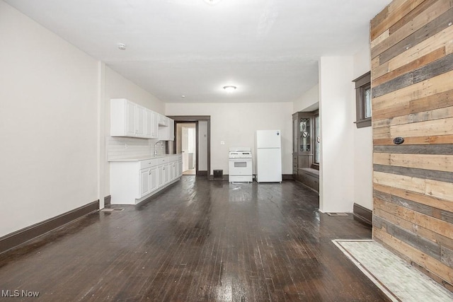 3139 W Blvd, Cleveland, OH 44111 - unfurnished living room with dark wood-type flooring and wood walls