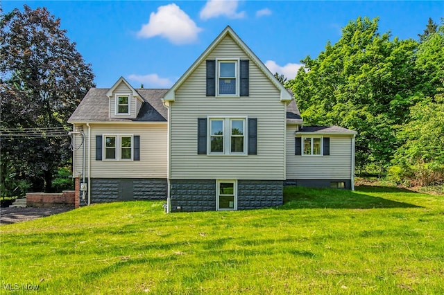 416 N Hambden St, Chardon, OH 44024 - back of property with a yard and roof with shingles