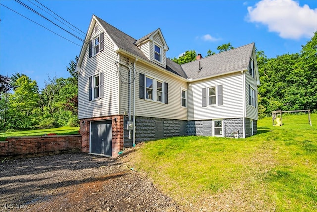 416 N Hambden St, Chardon, OH 44024 - view of home's exterior with a yard, driveway, an attached garage, roof with shingles, and a chimney