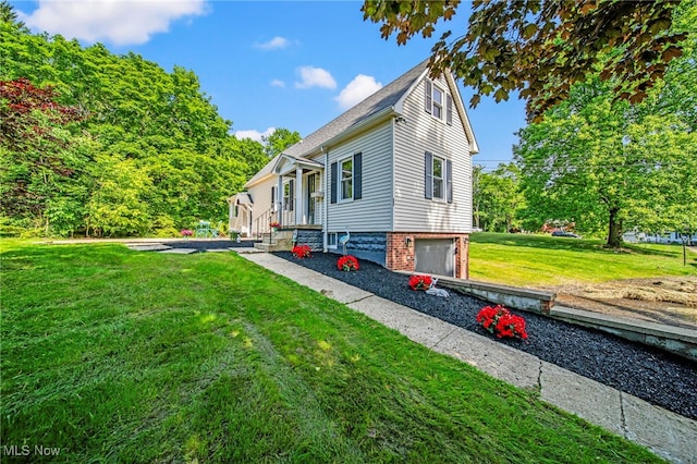 416 N Hambden St, Chardon, OH 44024 - view of side of home with a lawn and a garage