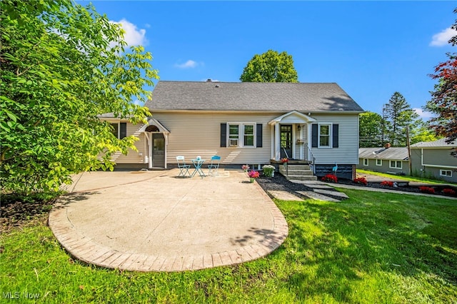 416 N Hambden St, Chardon, OH 44024 - back of house featuring a patio and a lawn