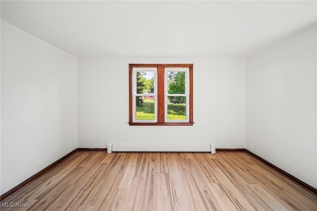 416 N Hambden St, Chardon, OH 44024 - empty room featuring baseboard heating and light wood-type flooring