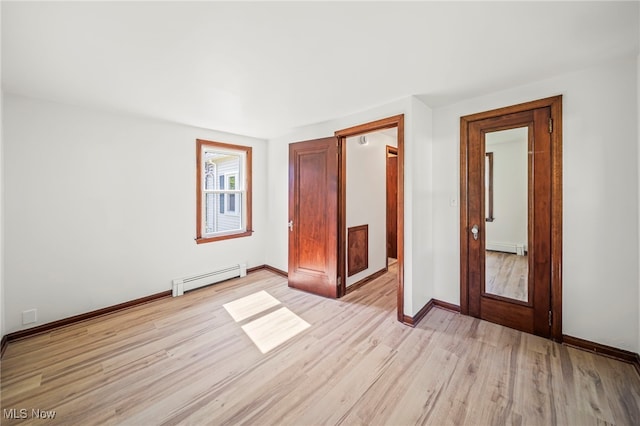 416 N Hambden St, Chardon, OH 44024 - unfurnished bedroom with a baseboard radiator and light wood finished floors