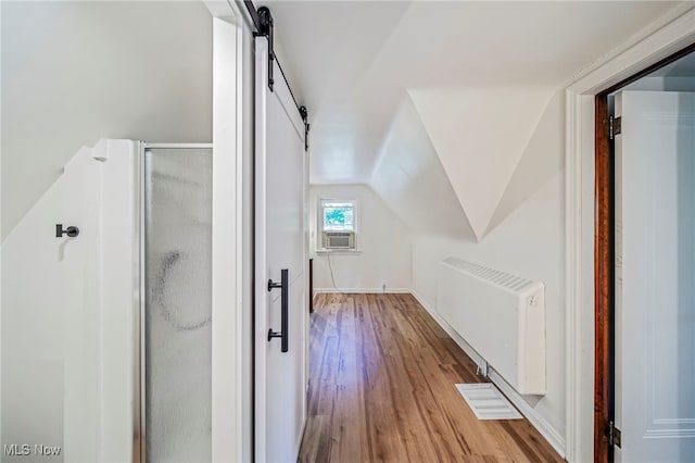 416 N Hambden St, Chardon, OH 44024 - bonus room with radiator heating unit, wood finished floors, lofted ceiling, and cooling unit